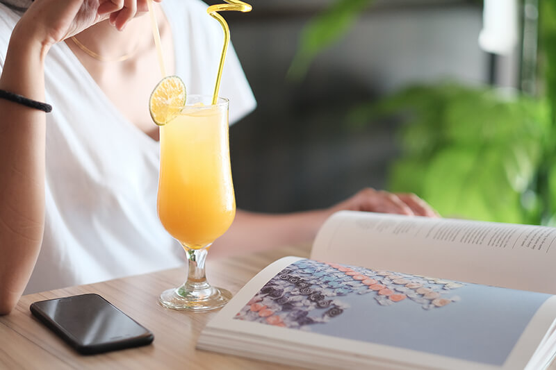 photo of a mimosa and a woman's torso